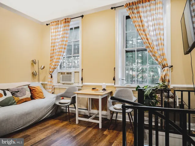 a view of a livingroom with furniture and window