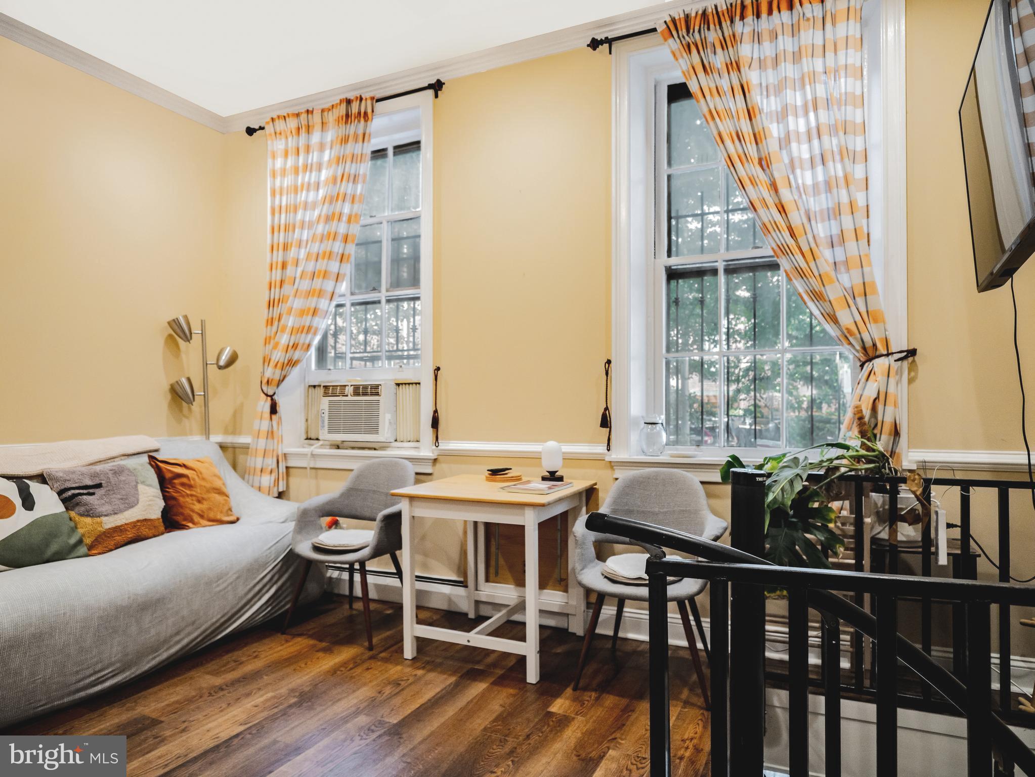 265 South 9th Street, Unit 1F Philadelphia, PA 19107 - Photo 7 of 15 a view of a livingroom with furniture and window