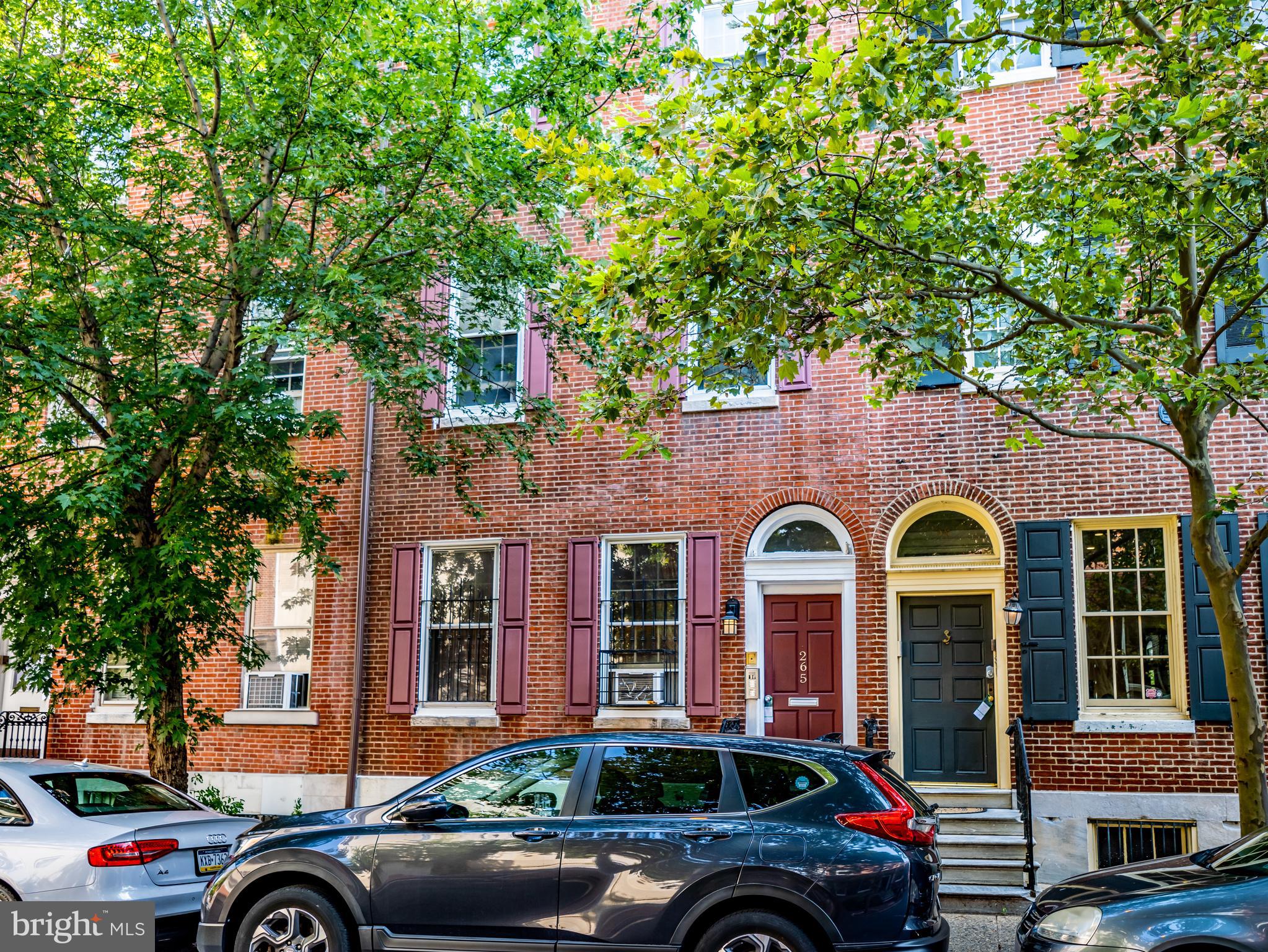 265 South 9th Street, Unit 1F Philadelphia, PA 19107 - Photo 9 of 15 a front view of a house with parking area