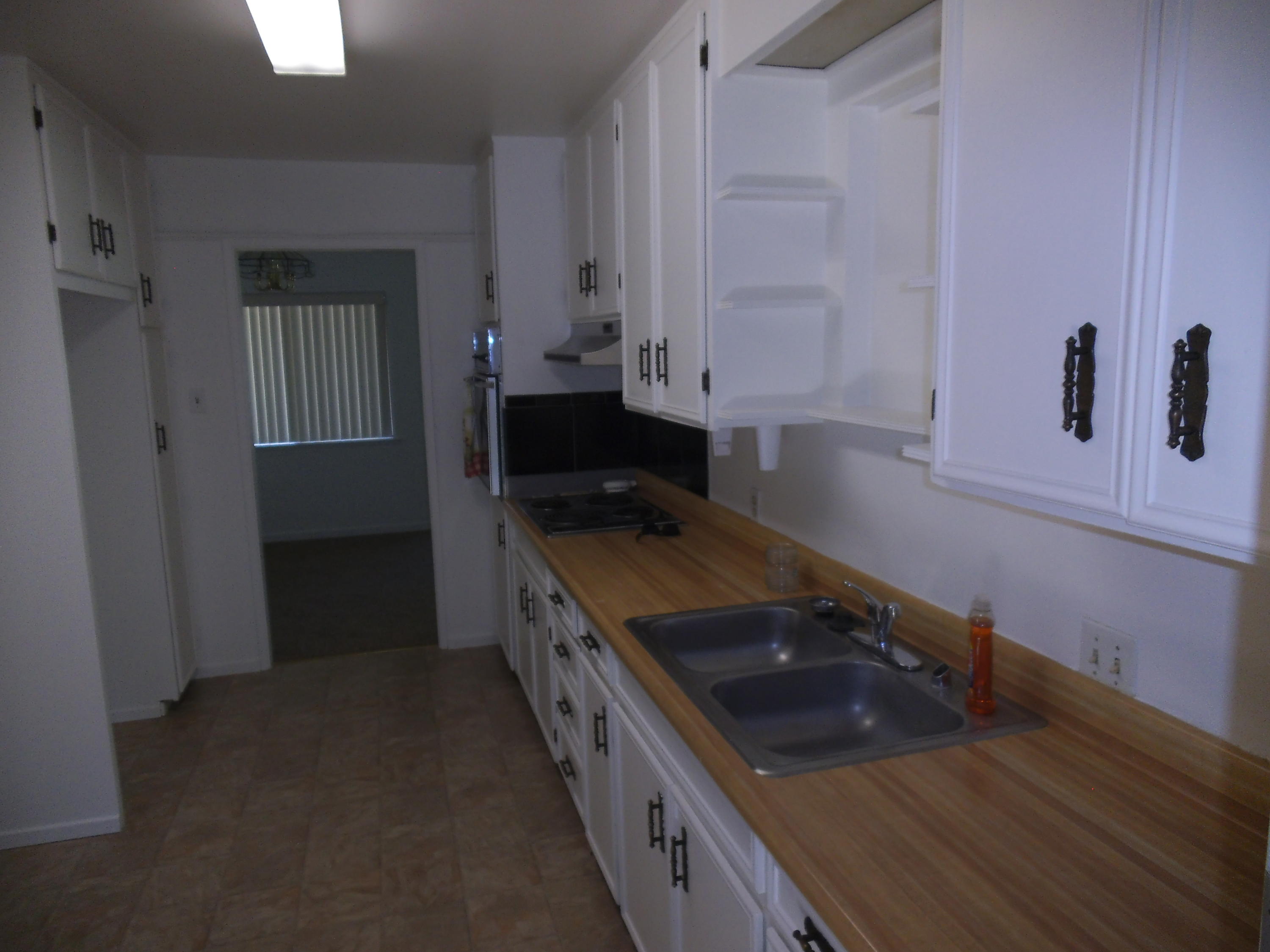 3607 Ricardo Avenue Redding, CA 96002 - Photo 19 of 20 a kitchen with a stove and a sink