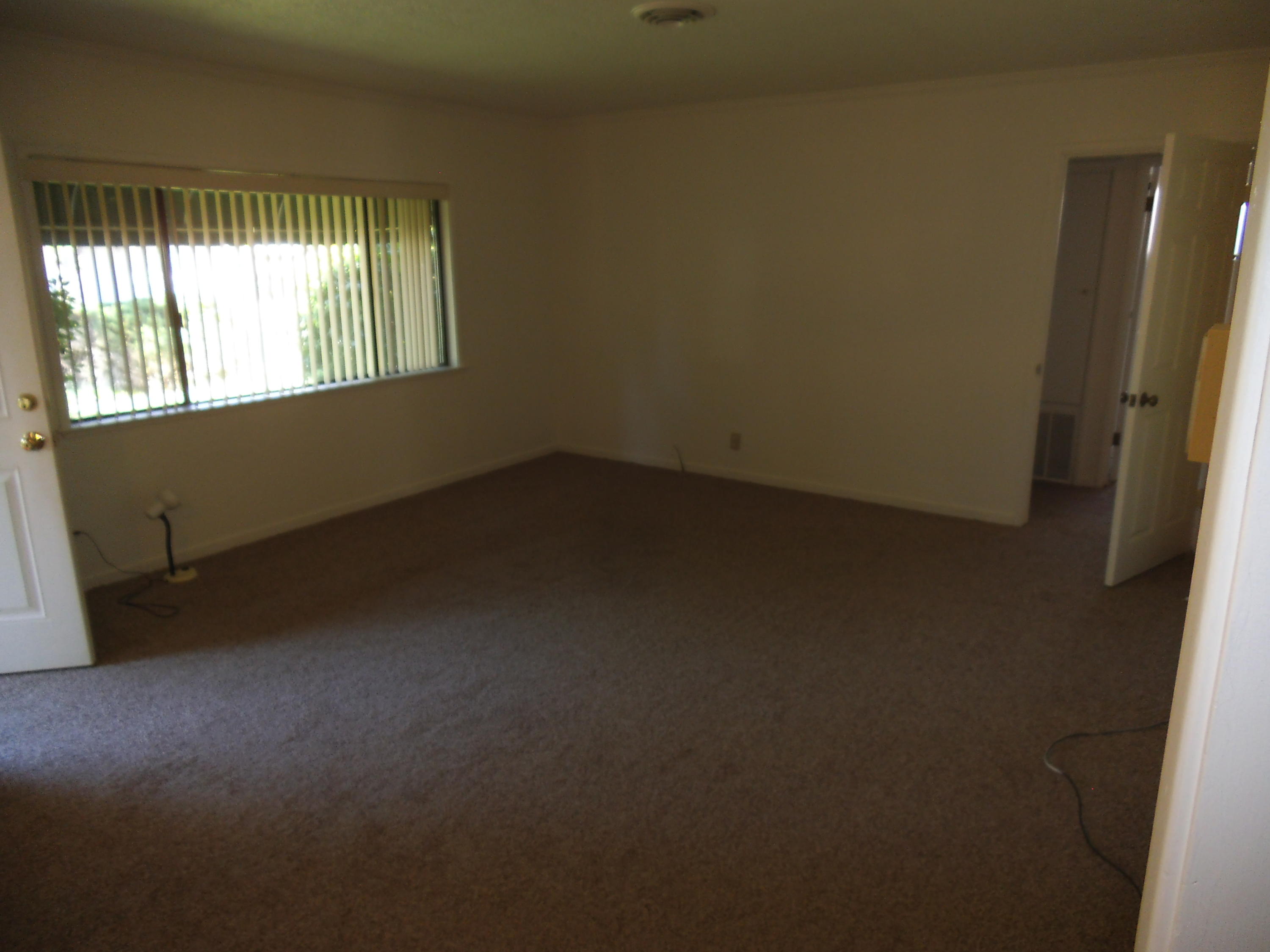 3607 Ricardo Avenue Redding, CA 96002 - Photo 7 of 20 an empty room with a empty space and windows