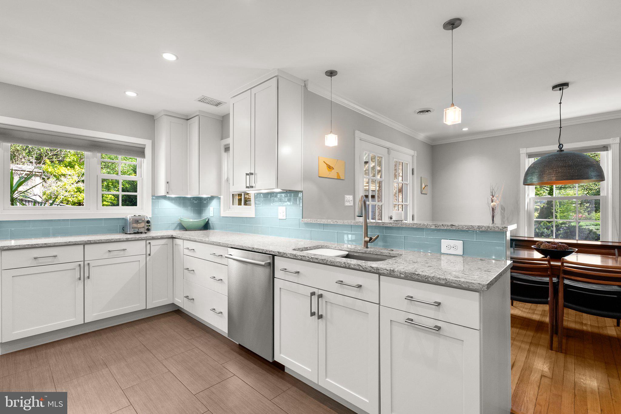 507 Ellsworth Drive Silver Spring, MD 20910 - Photo 12 of 42 a kitchen with a sink stove and cabinets