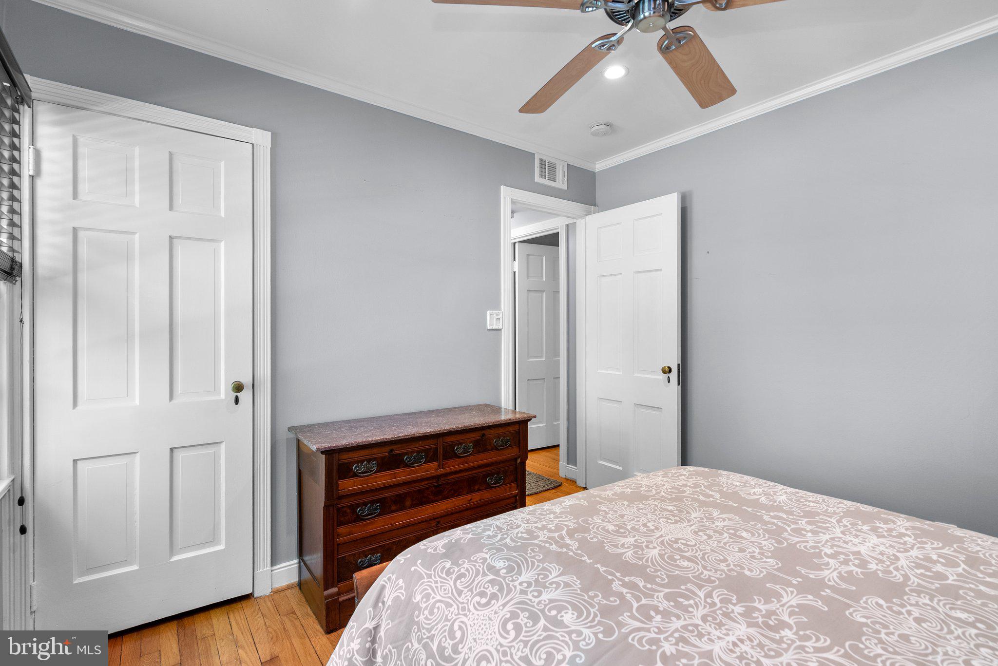 507 Ellsworth Drive Silver Spring, MD 20910 - Photo 18 of 42 a bedroom with a bed and a ceiling fan