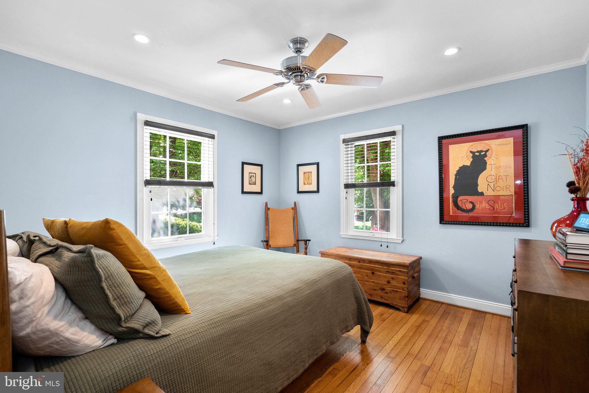 507 Ellsworth Drive Silver Spring, MD 20910 - Photo 19 of 42 a bedroom with a bed and wooden floor