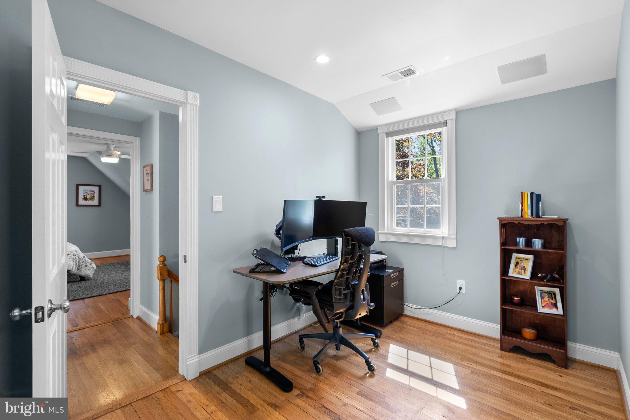 507 Ellsworth Drive Silver Spring, MD 20910 - Photo 23 of 42 a view of a workspace with wooden floor and a window