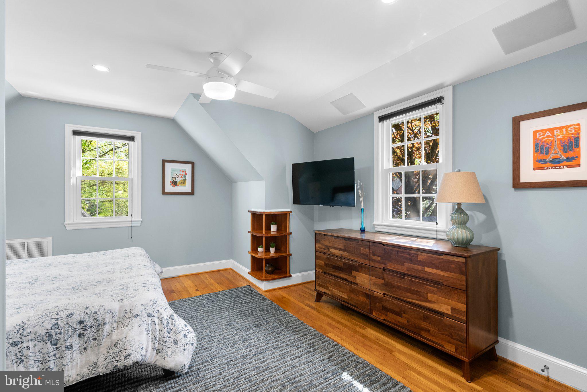 507 Ellsworth Drive Silver Spring, MD 20910 - Photo 27 of 42 a bedroom with furniture and flat screen tv
