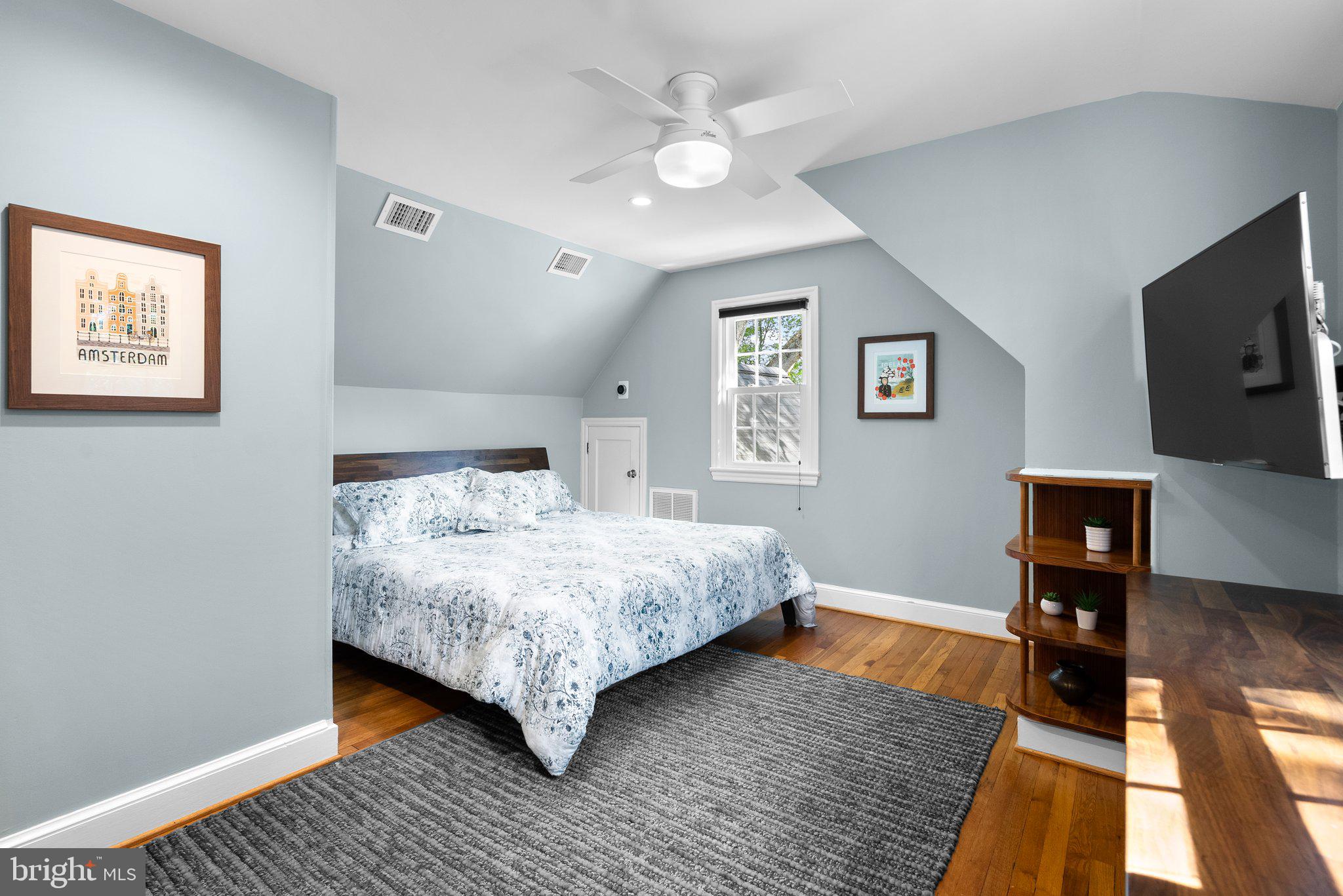 507 Ellsworth Drive Silver Spring, MD 20910 - Photo 28 of 42 a bedroom with a bed and a flat screen tv