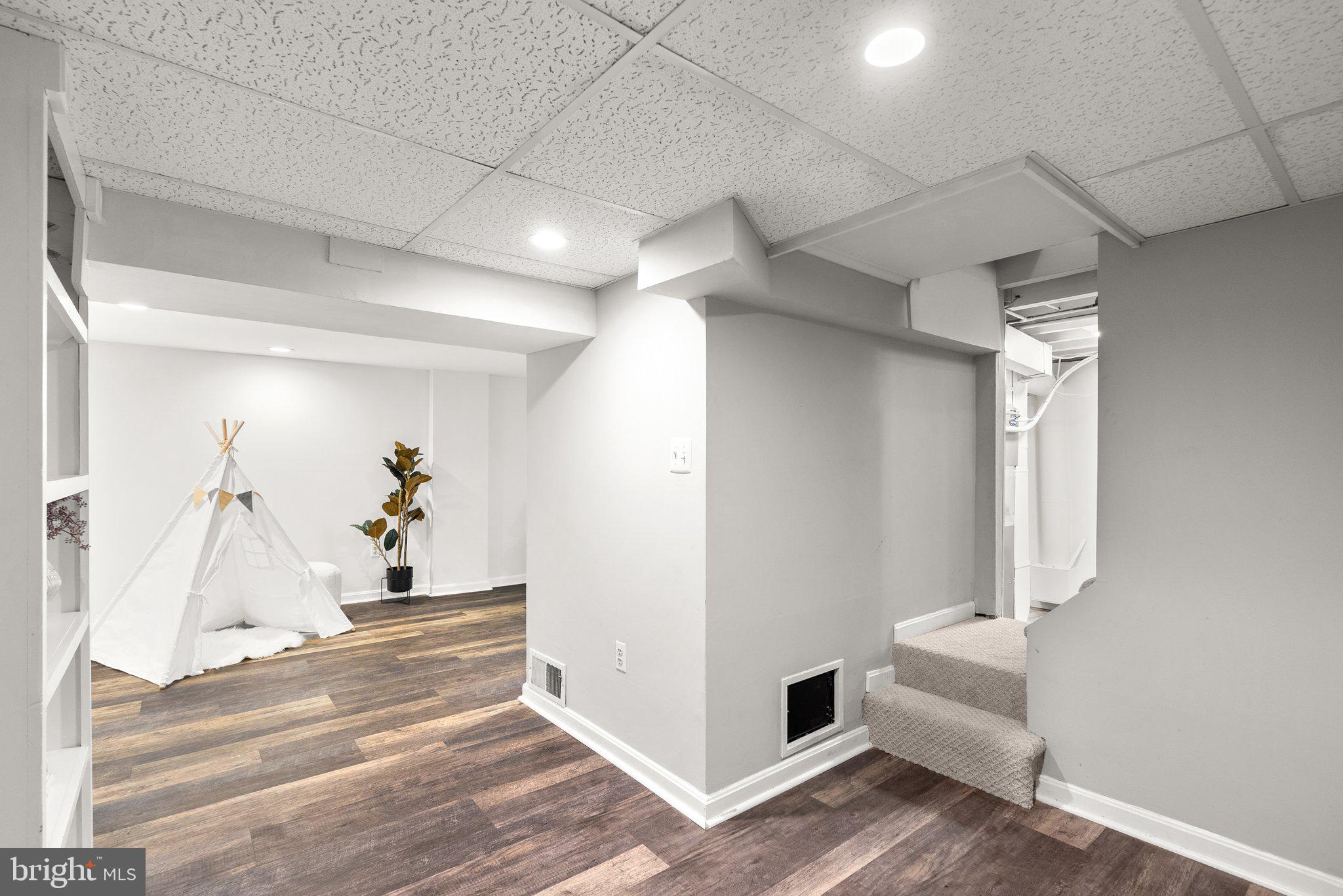 507 Ellsworth Drive Silver Spring, MD 20910 - Photo 30 of 42 a view of a livingroom with wooden floor and cabinet