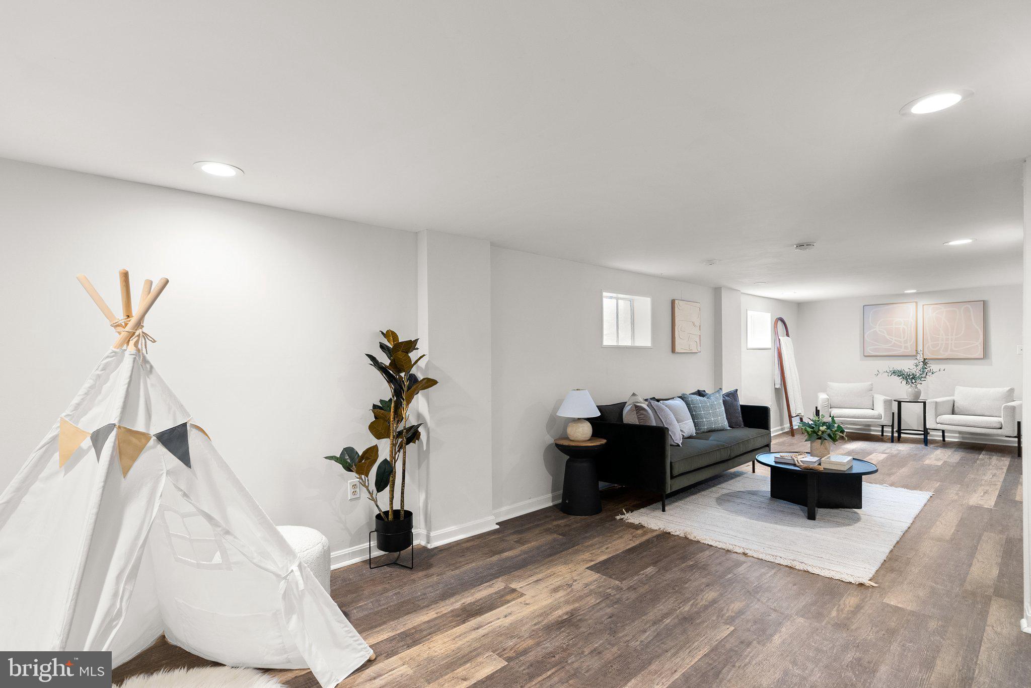 507 Ellsworth Drive Silver Spring, MD 20910 - Photo 31 of 42 a living room with furniture or wooden floor and a window