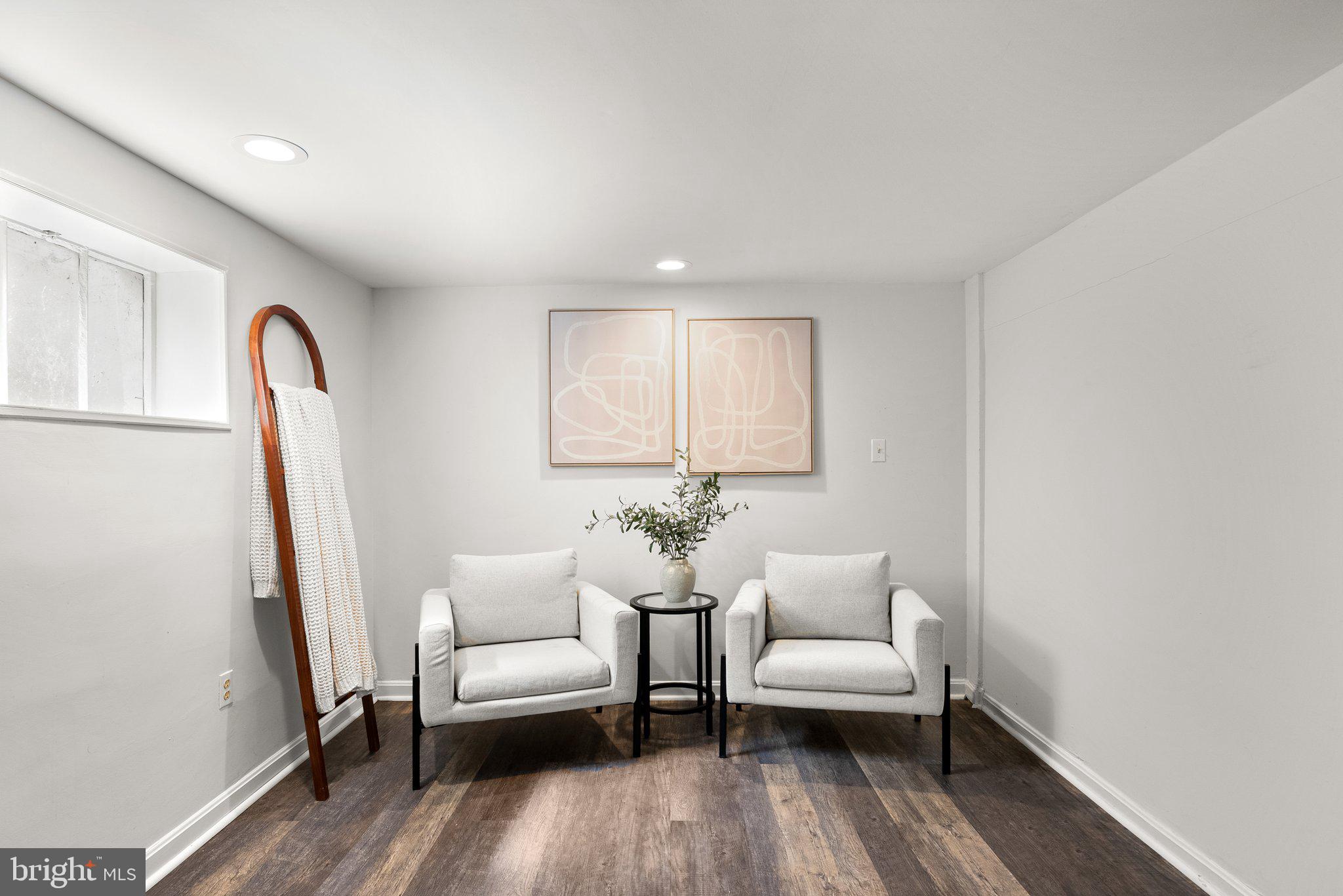 507 Ellsworth Drive Silver Spring, MD 20910 - Photo 32 of 42 a living room with furniture and a couch