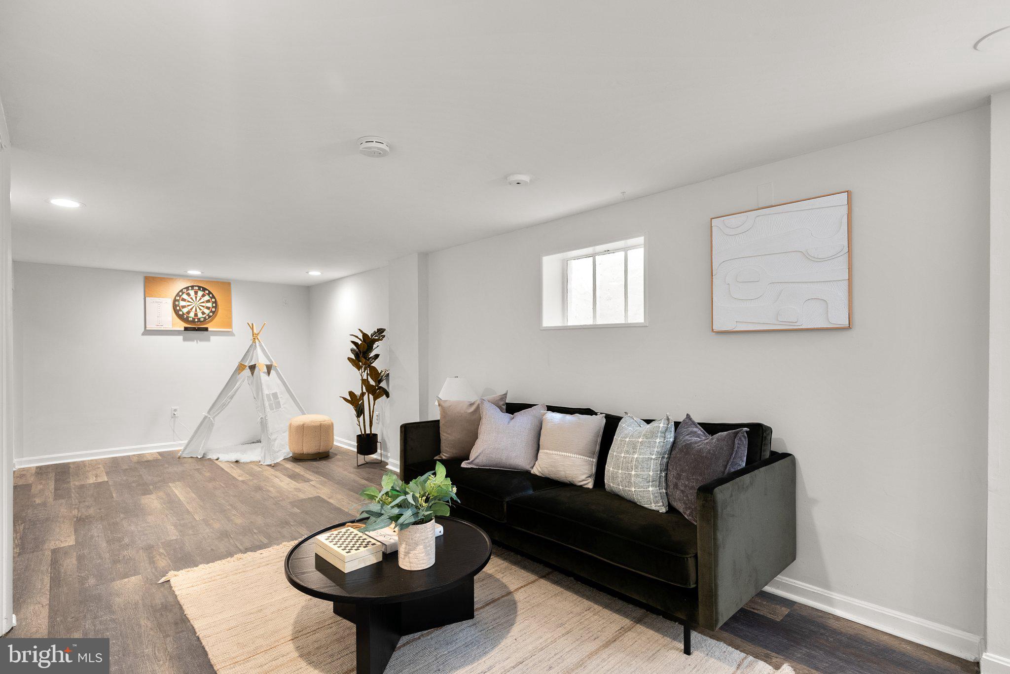 507 Ellsworth Drive Silver Spring, MD 20910 - Photo 33 of 42 a living room with furniture and a wooden floor