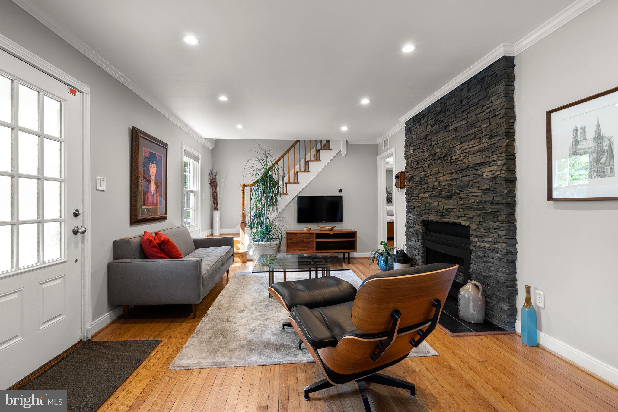 507 Ellsworth Drive Silver Spring, MD 20910 - Photo 5 of 42 a living room with furniture and a fireplace