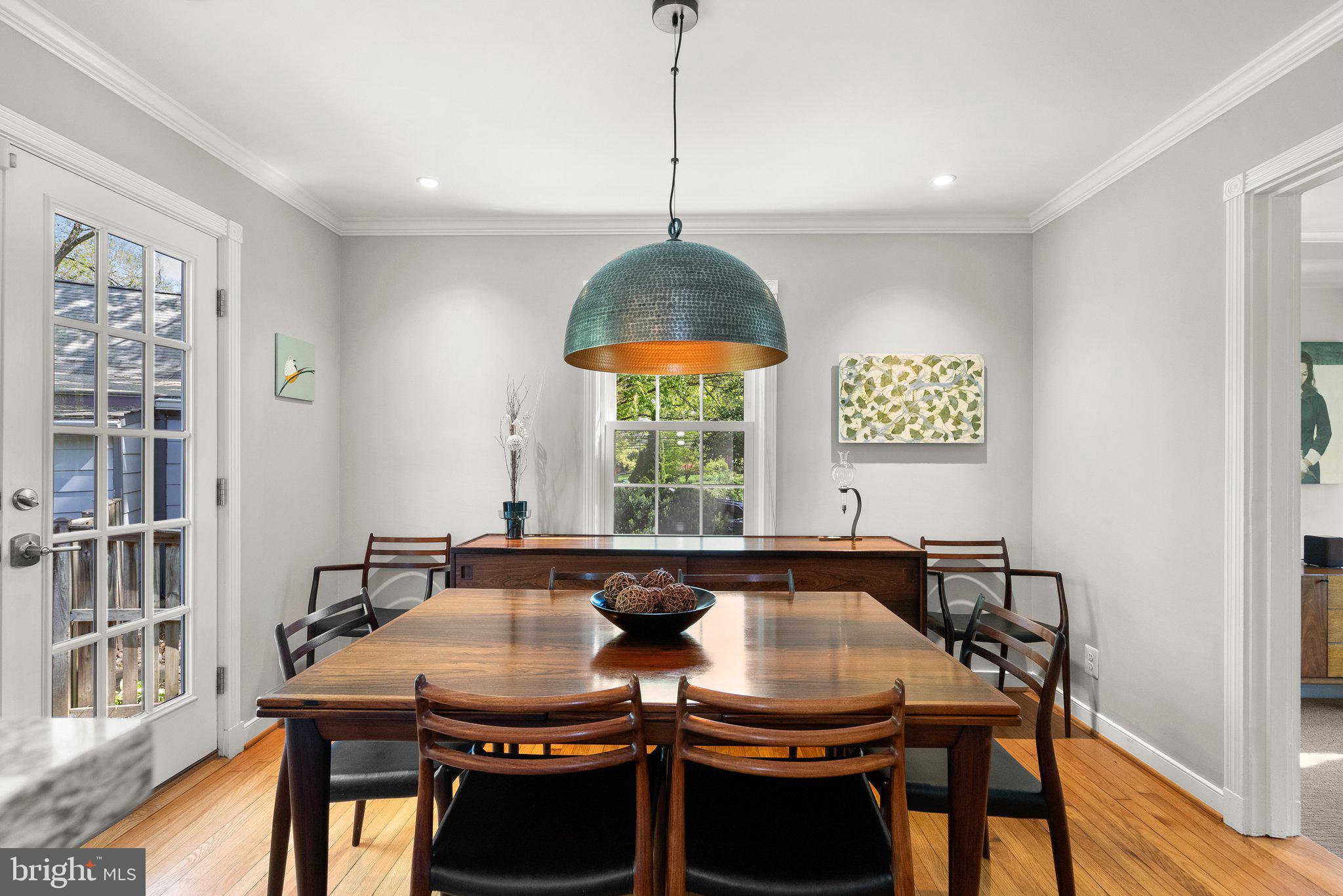 507 Ellsworth Drive Silver Spring, MD 20910 - Photo 10 of 42 a view of a dining room with furniture window and wooden floor