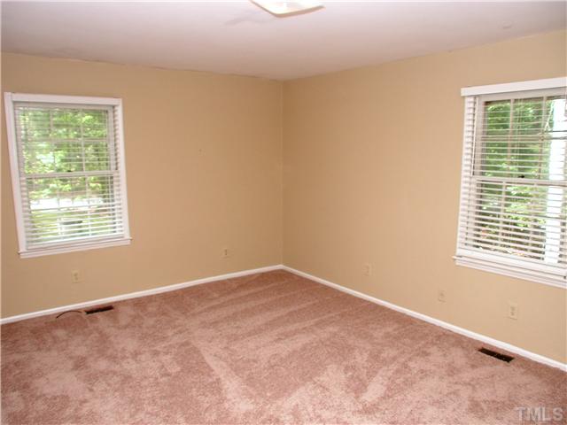 8416 Azalea Place Raleigh, NC 27613 - Photo 10 of 12 a view of an empty room with a window