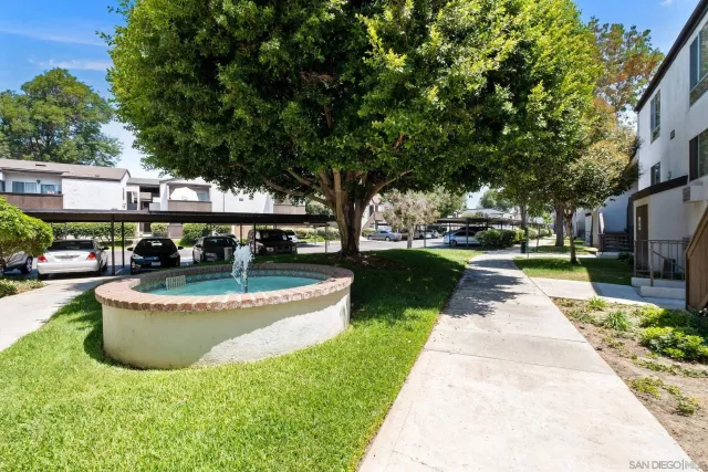 a view of a swimming pool with sitting area