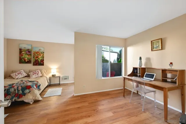 a room with furniture and a wooden floor