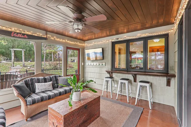 a kitchen with granite countertop a sink and a stove