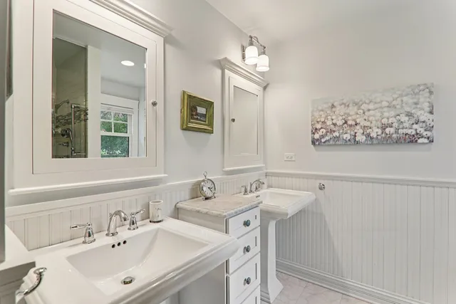 a bathroom with a shower and a glass door