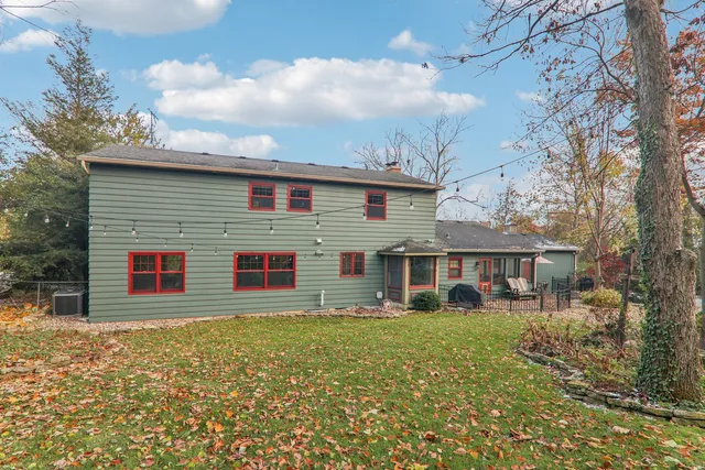 a front view of a house with a garden and porch