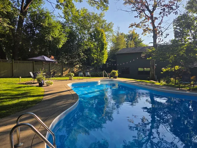 a view of a table and chairs in the garden