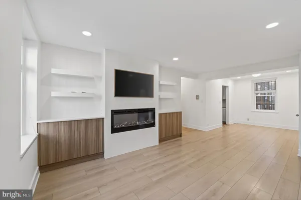 a view of a kitchen with microwave and cabinets