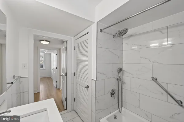 a bathroom with sink and bathtub