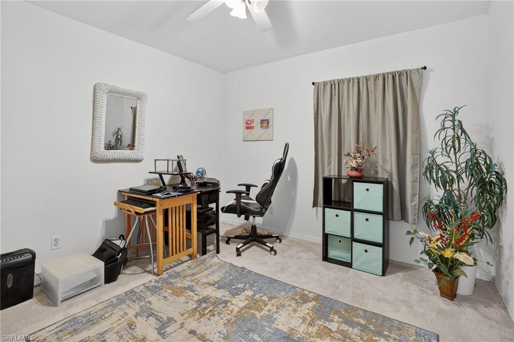3920 10th Street North Naples, FL 34103 - Photo 25 of 47 Office area with carpet flooring and a ceiling fan