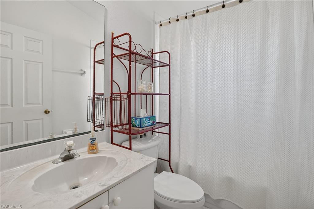 3920 10th Street North Naples, FL 34103 - Photo 28 of 47 Bathroom with vanity and shower / bath combo