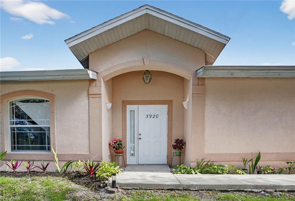 3920 10th Street North Naples, FL 34103 - Photo 3 of 47 Property main entrance.
