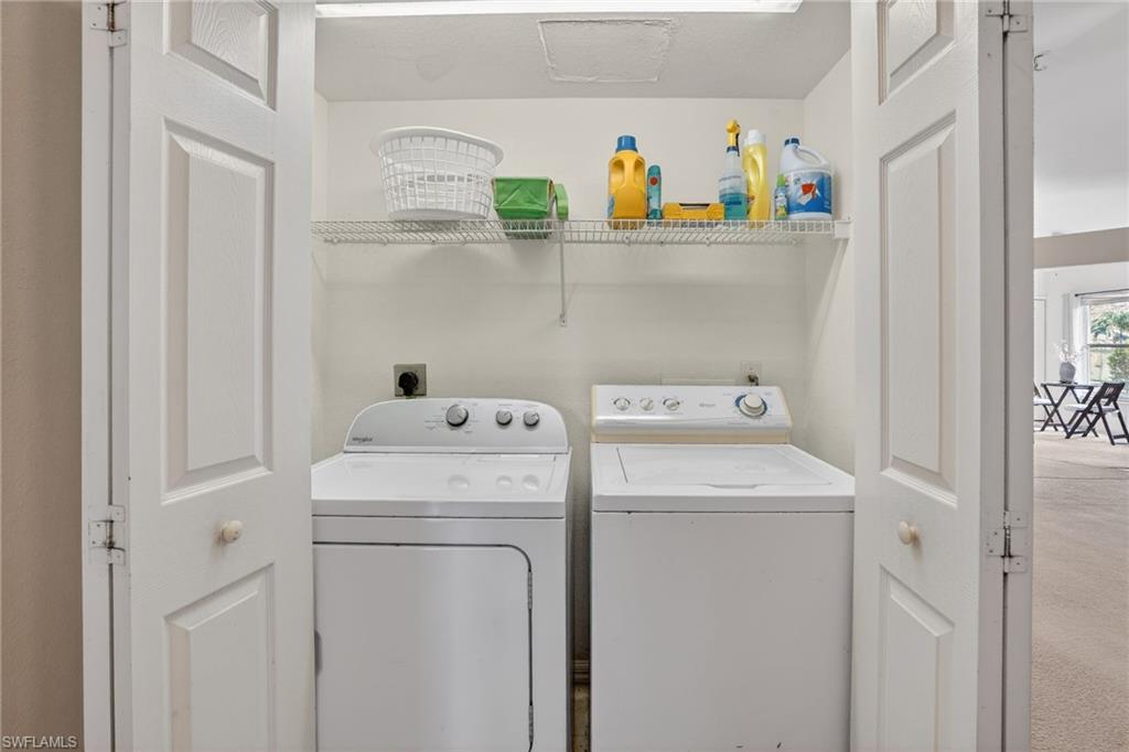 3920 10th Street North Naples, FL 34103 - Photo 41 of 47 Washroom featuring washing machine and dryer