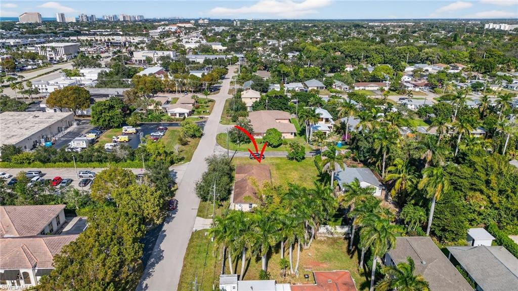 3920 10th Street North Naples, FL 34103 - Photo 42 of 47 Aerial view of property and surrounding area with nearby suburban area and nearby urban area