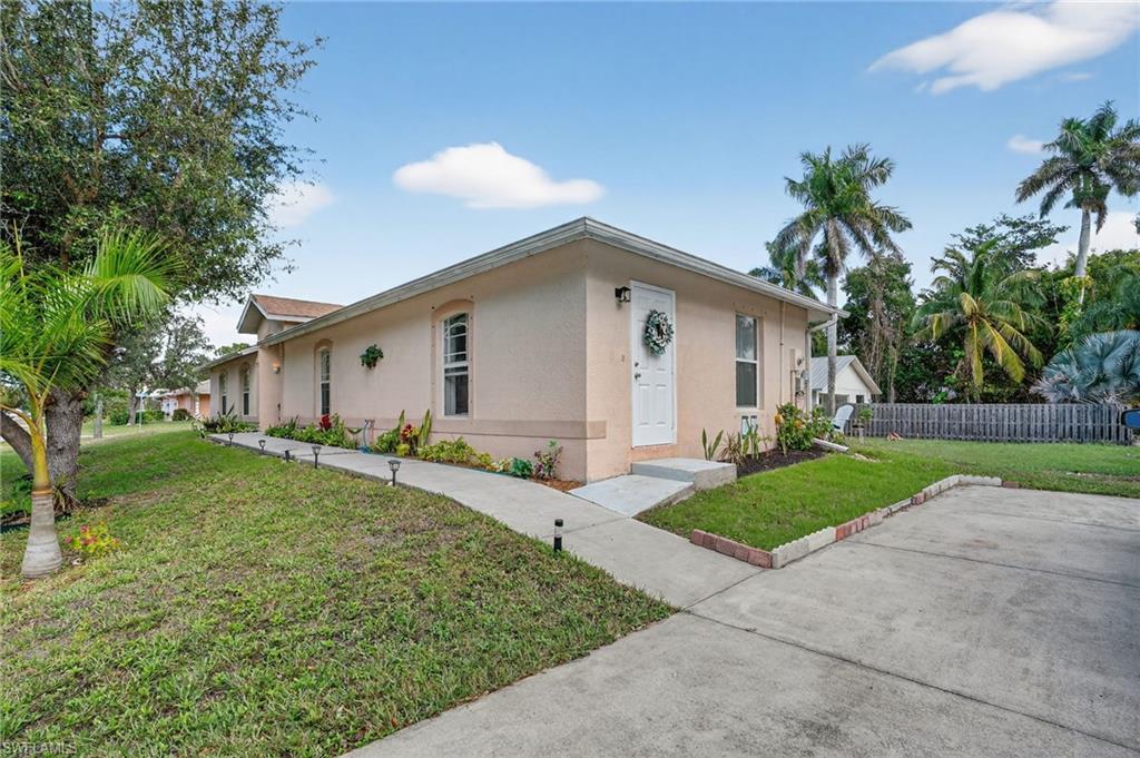 3920 10th Street North Naples, FL 34103 - Photo 5 of 47 Rear entrance and driveway.