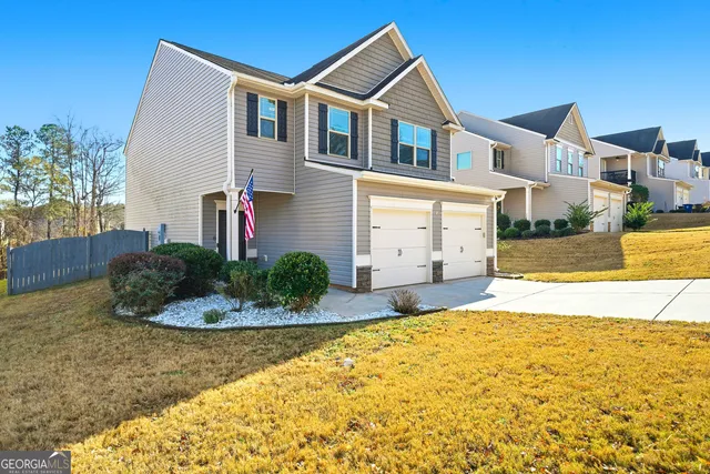 a front view of a house with a yard