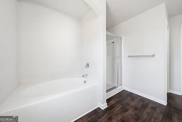 a white bath tub sitting in a bathroom