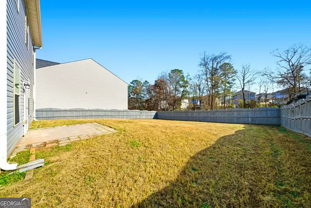 a view of a swimming pool with an outdoor space and seating area