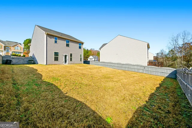 a view of swimming pool with a yard