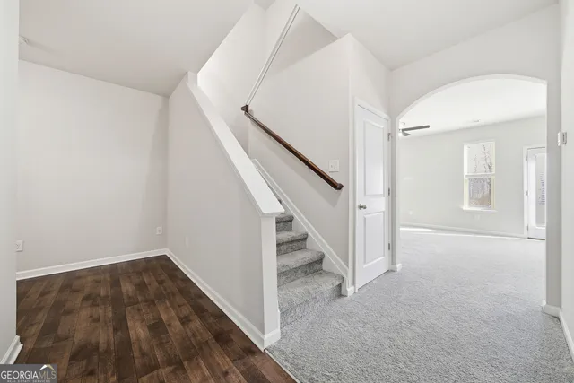 a view of a hallway with staircase