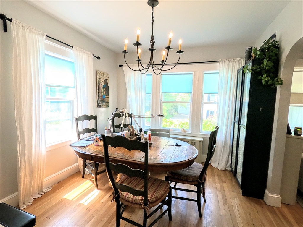 12 Searle Road, Unit 12 Boston, MA 02132 - Photo 3 of 35 a view of a dining room with furniture window and wooden floor
