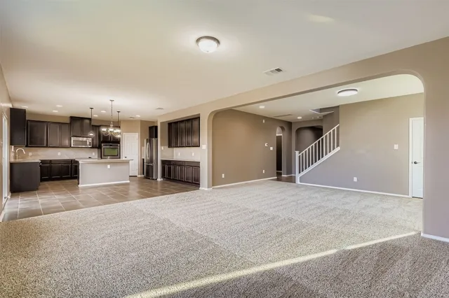 a view of a kitchen with a sink and a stove top oven