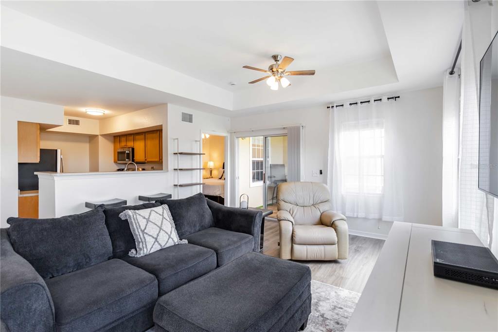 1050 Villagio Circle, Unit 206 Sarasota, FL 34237 - Photo 12 of 57 a living room with furniture and a large window