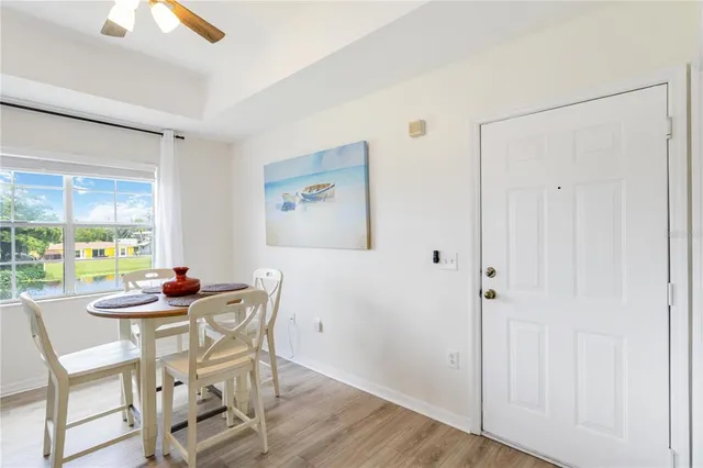 a dining room with furniture and window