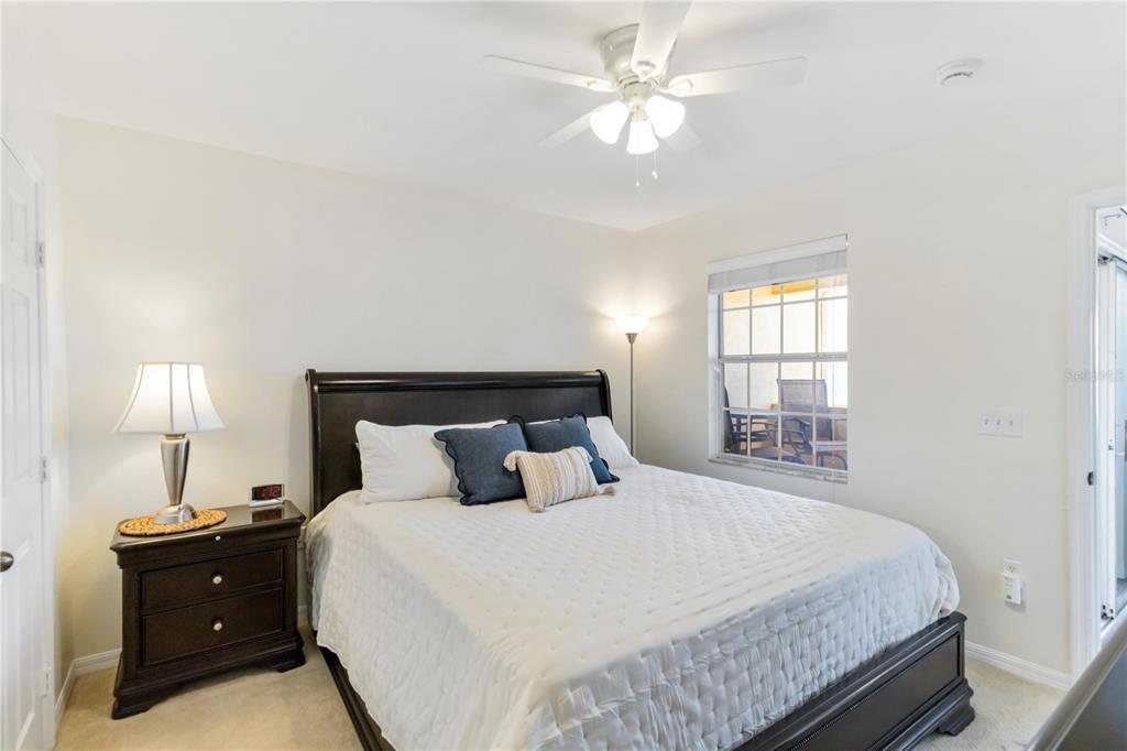 1050 Villagio Circle, Unit 206 Sarasota, FL 34237 - Photo 22 of 57 a bedroom with a bed and a window