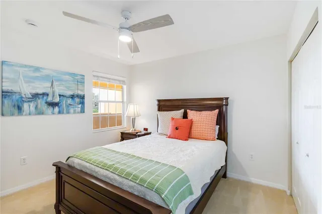 a bedroom with a bed and window