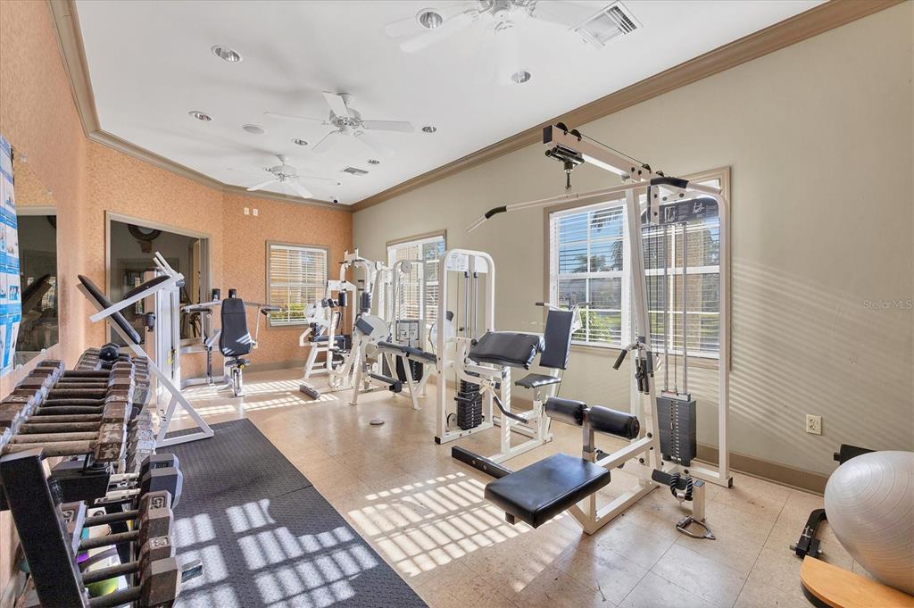 1050 Villagio Circle, Unit 206 Sarasota, FL 34237 - Photo 50 of 57 a living room with furniture and wooden floor