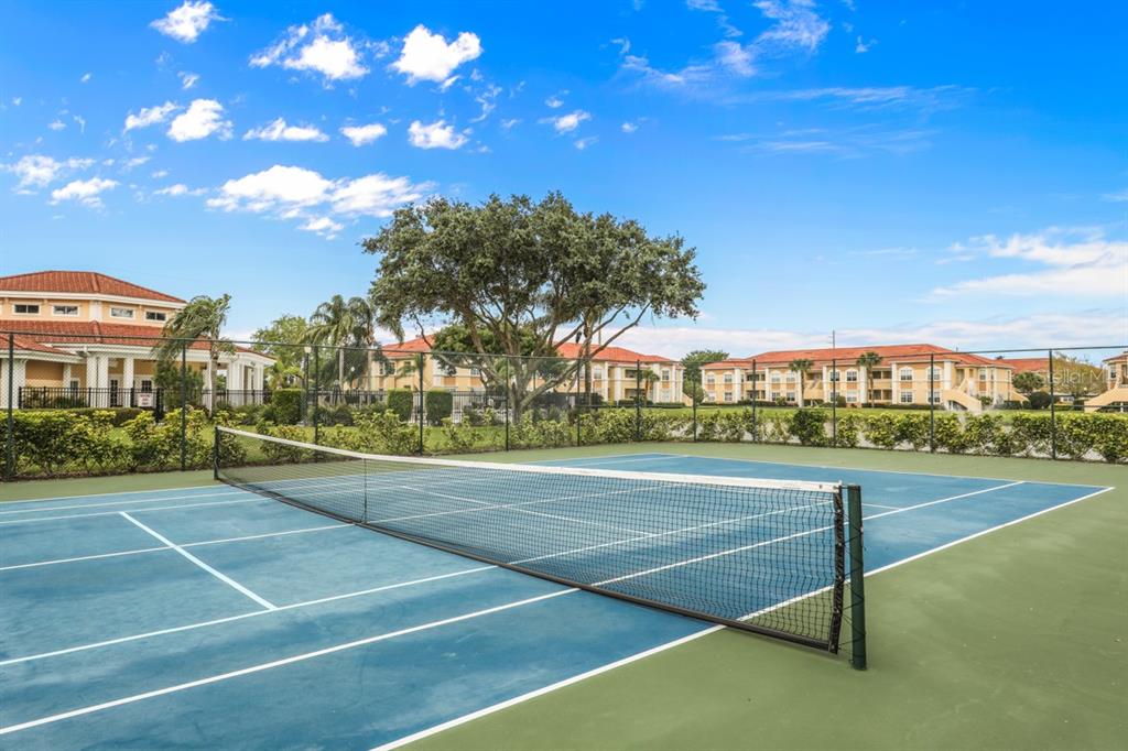 1050 Villagio Circle, Unit 206 Sarasota, FL 34237 - Photo 52 of 57 a view of an outdoor space and basketball court