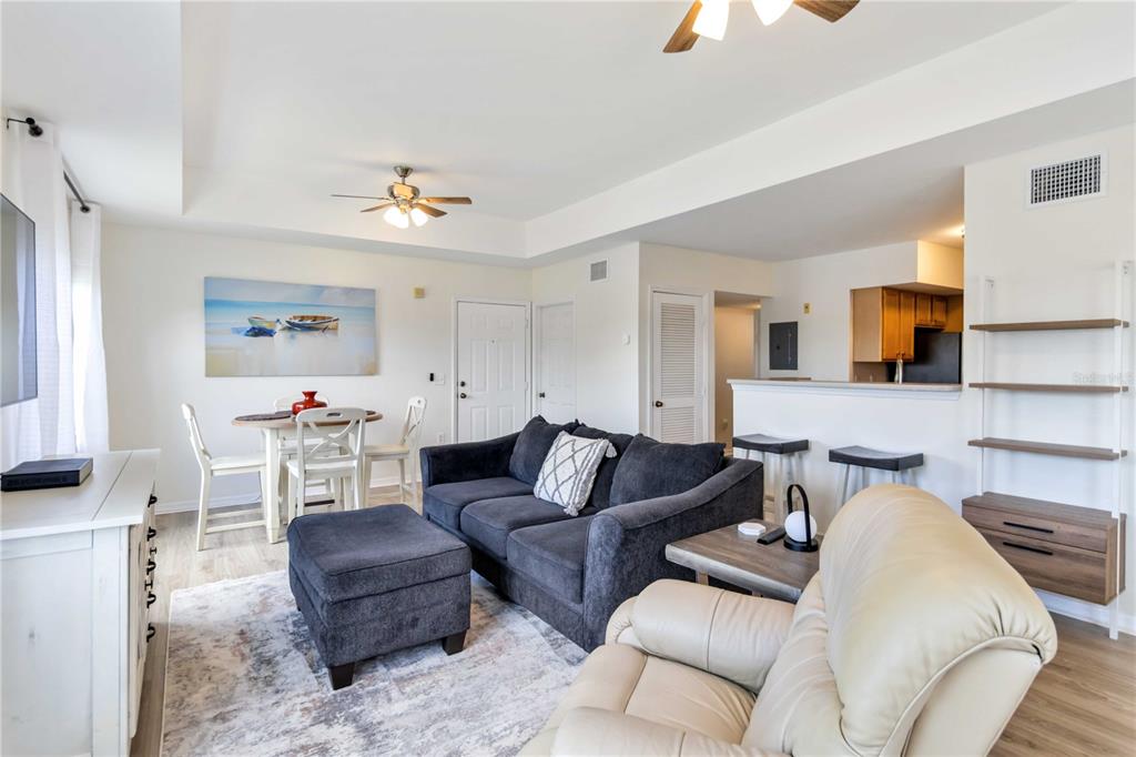 1050 Villagio Circle, Unit 206 Sarasota, FL 34237 - Photo 10 of 57 a living room with furniture and a lamp