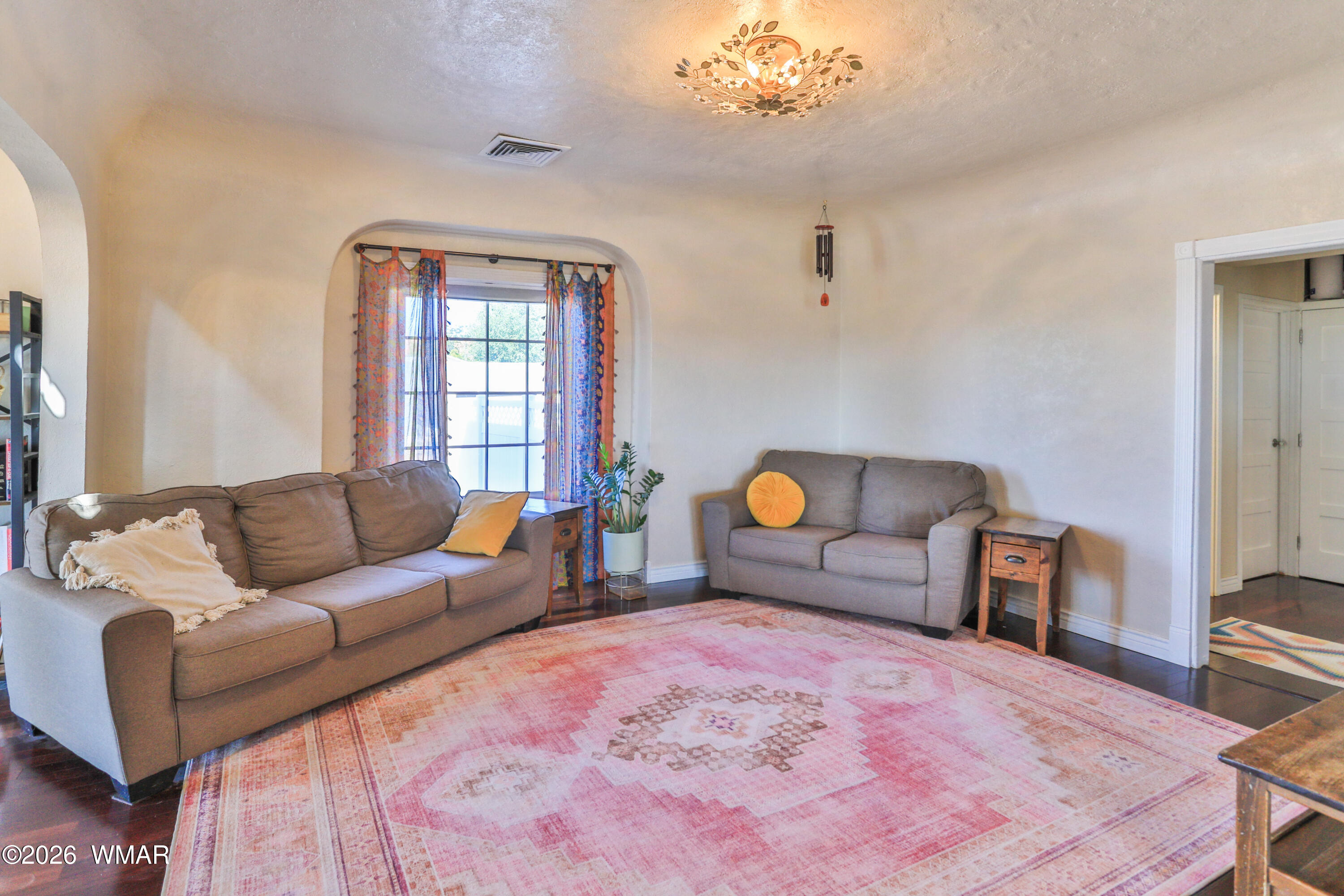 102 Crestview Road Holbrook, AZ 86025 - Photo 17 of 55 a living room with furniture and a chandelier