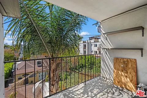 a view of parking garage with cars