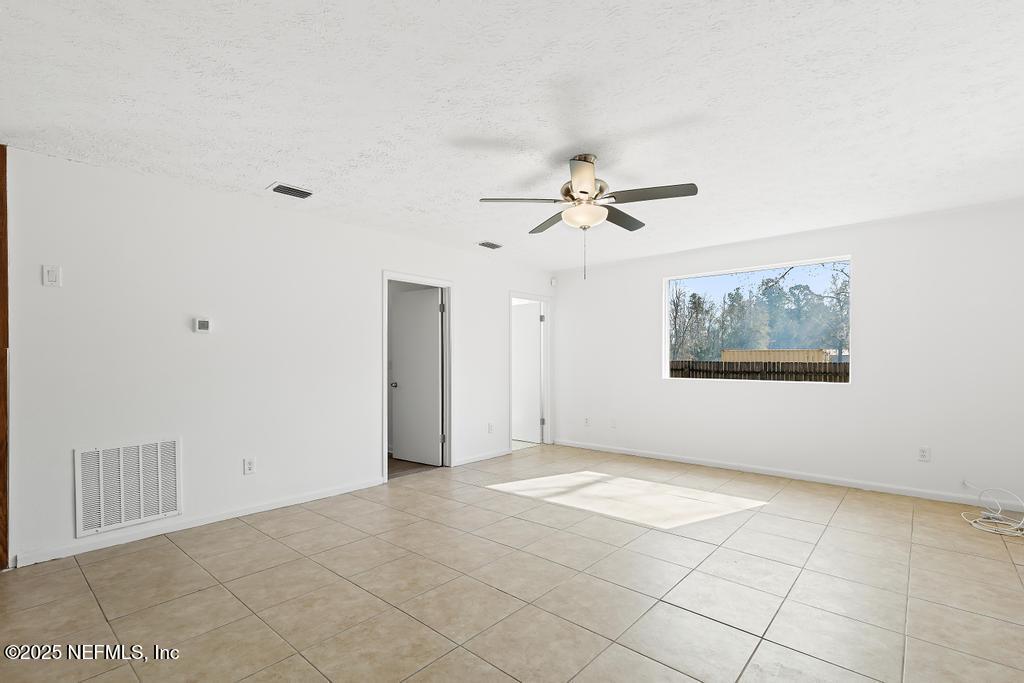 54074 Charles Street Callahan, FL 32011 - Photo 12 of 52 a view of an empty room with a window