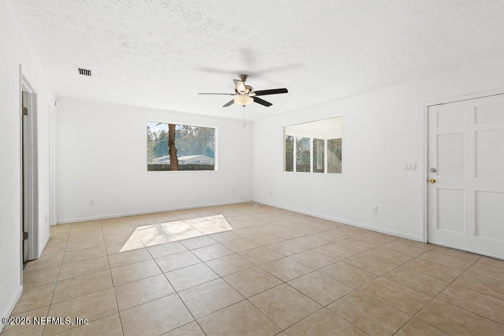 54074 Charles Street Callahan, FL 32011 - Photo 13 of 52 a view of an empty room with a window